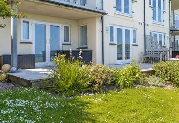 The large decking area is ideal for dining al fresco or sitting together with the family overlooking the sea. 