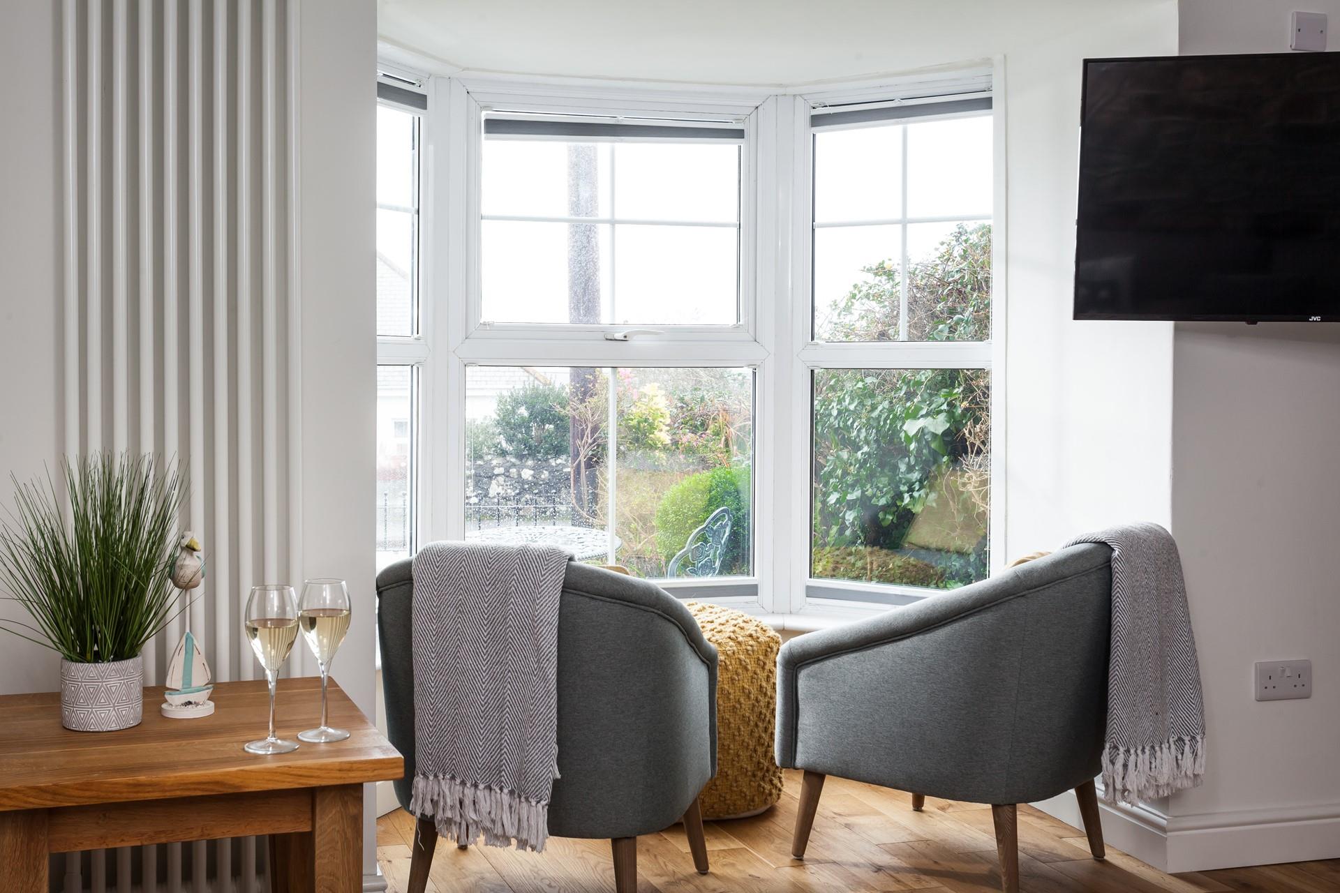 Sit it in the window seat and put your feet up with a good book.