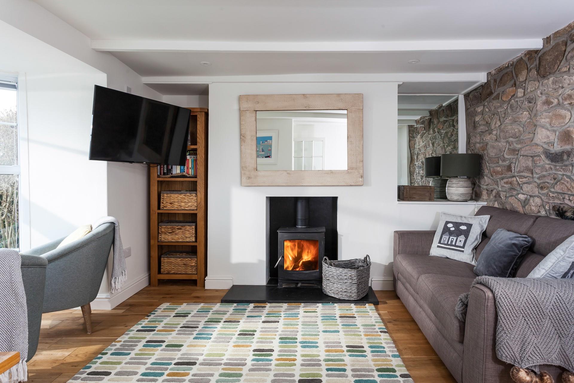 The sitting room has cosy furnishings and is the perfect space to relax.