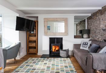 The sitting room has cosy furnishings and is the perfect space to relax.