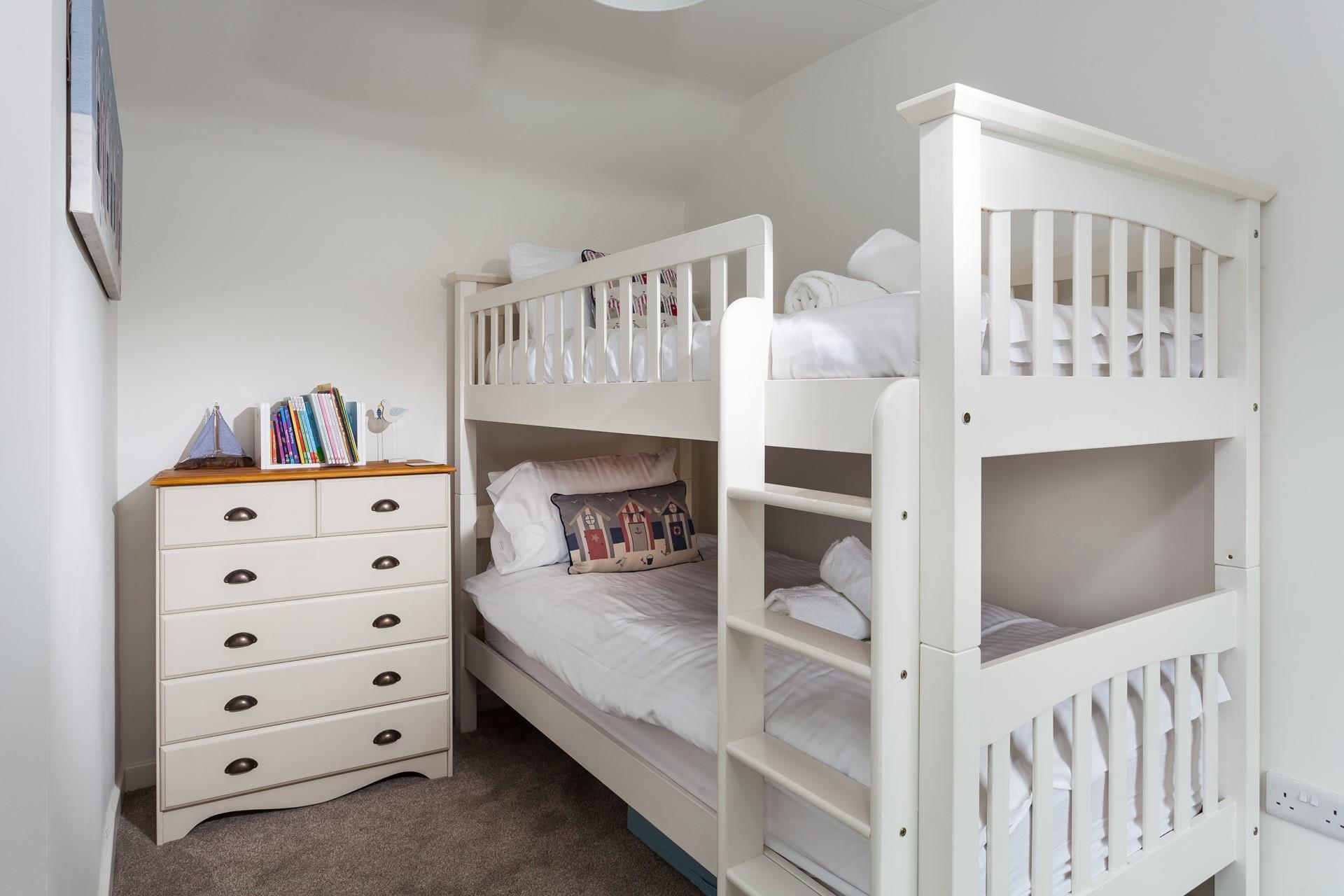 Tuck the kids into bed for a dreamy night's sleep in the bunk beds.