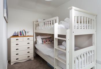 Tuck the kids into bed for a dreamy night's sleep in the bunk beds.