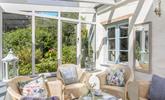The conservatory is the perfect place to admire the wildflower garden while you enjoy a morning cuppa. - Thumbnail Image