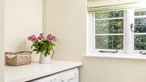 A handy utility room is great for sandy flip-flops or muddy wellies.