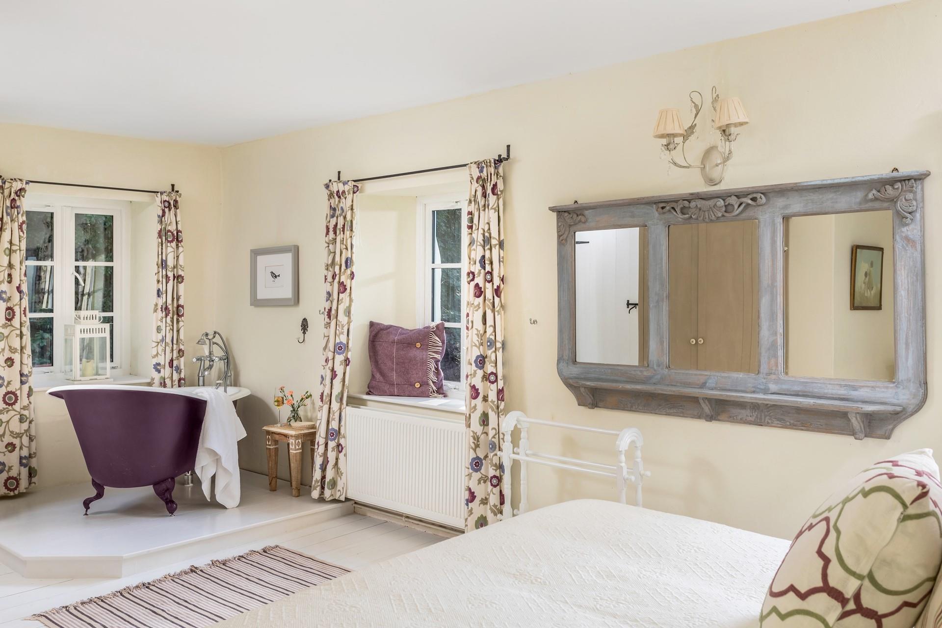 Soak in the roll-top bath after a day of exploring the South West Coast Path.