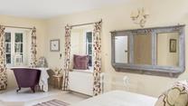 Soak in the roll-top bath after a day of exploring the South West Coast Path.