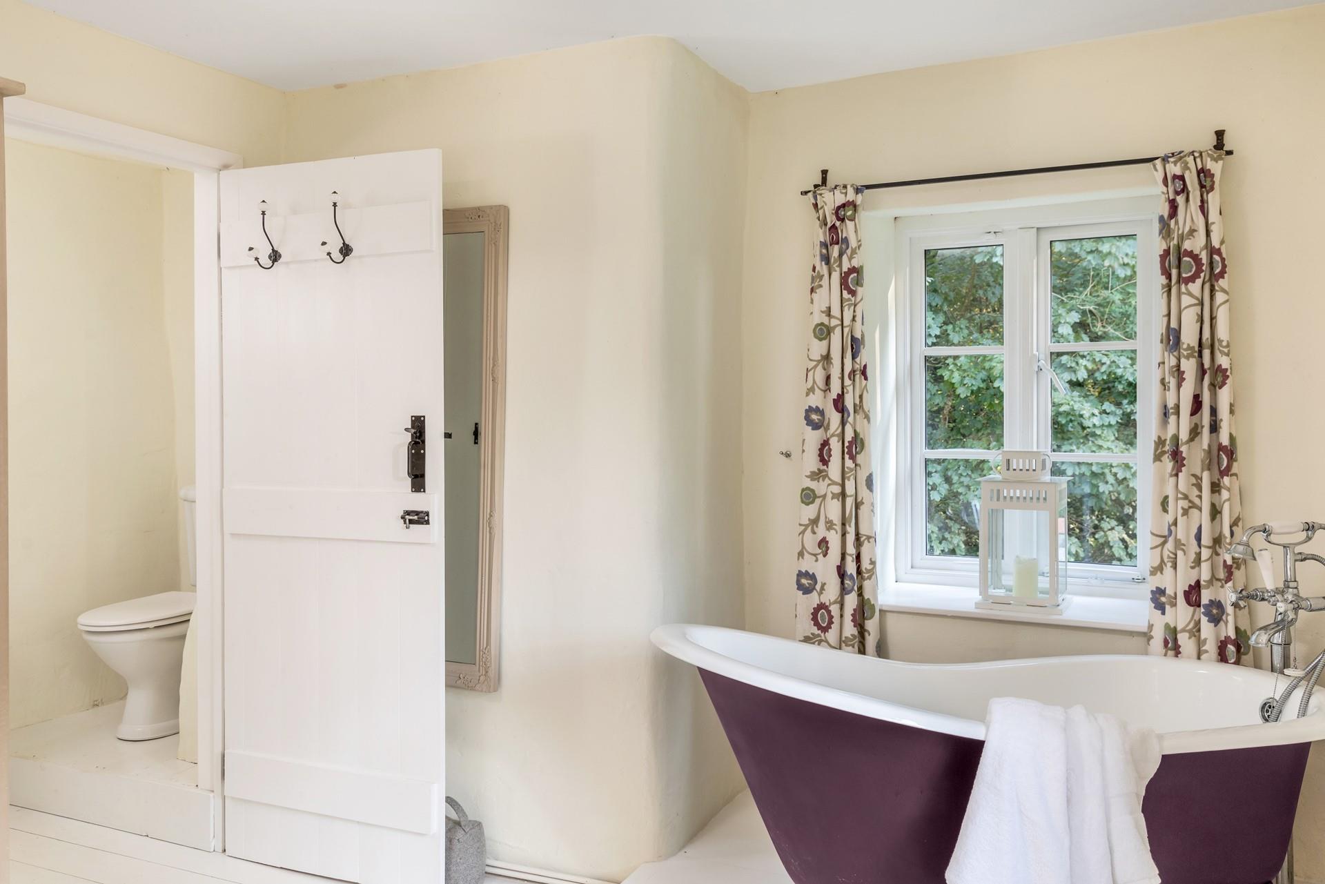 Watch the trees dancing in the breeze whilst indulging in a relaxing bath. 