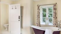 Watch the trees dancing in the breeze whilst indulging in a relaxing bath. 
