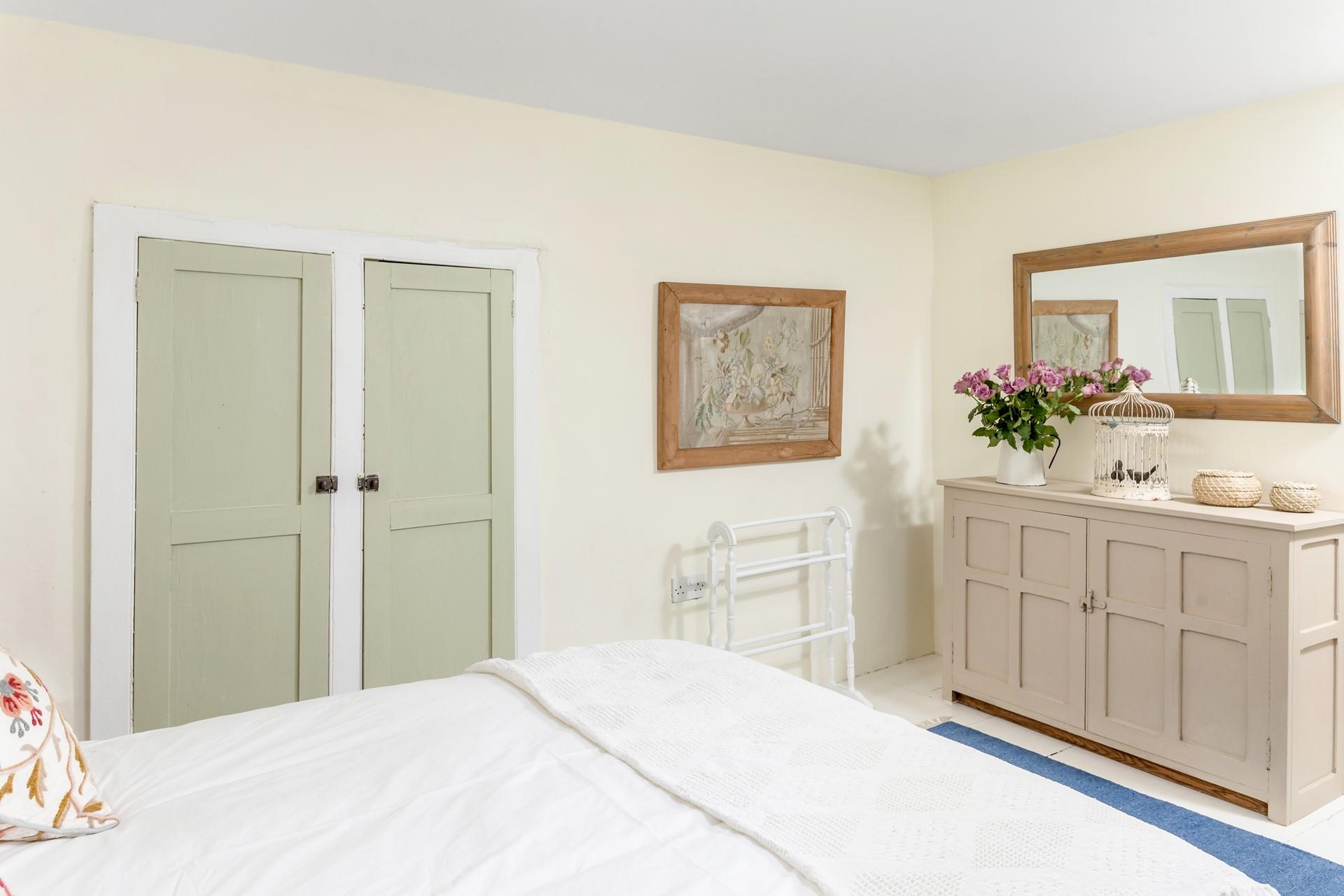 Neutral hues create a serene bedroom for a peaceful slumber.