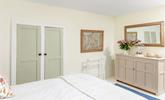 Neutral hues create a serene bedroom for a peaceful slumber. - Thumbnail Image
