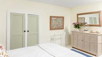 Neutral hues create a serene bedroom for a peaceful slumber.