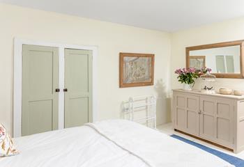 Neutral hues create a serene bedroom for a peaceful slumber.