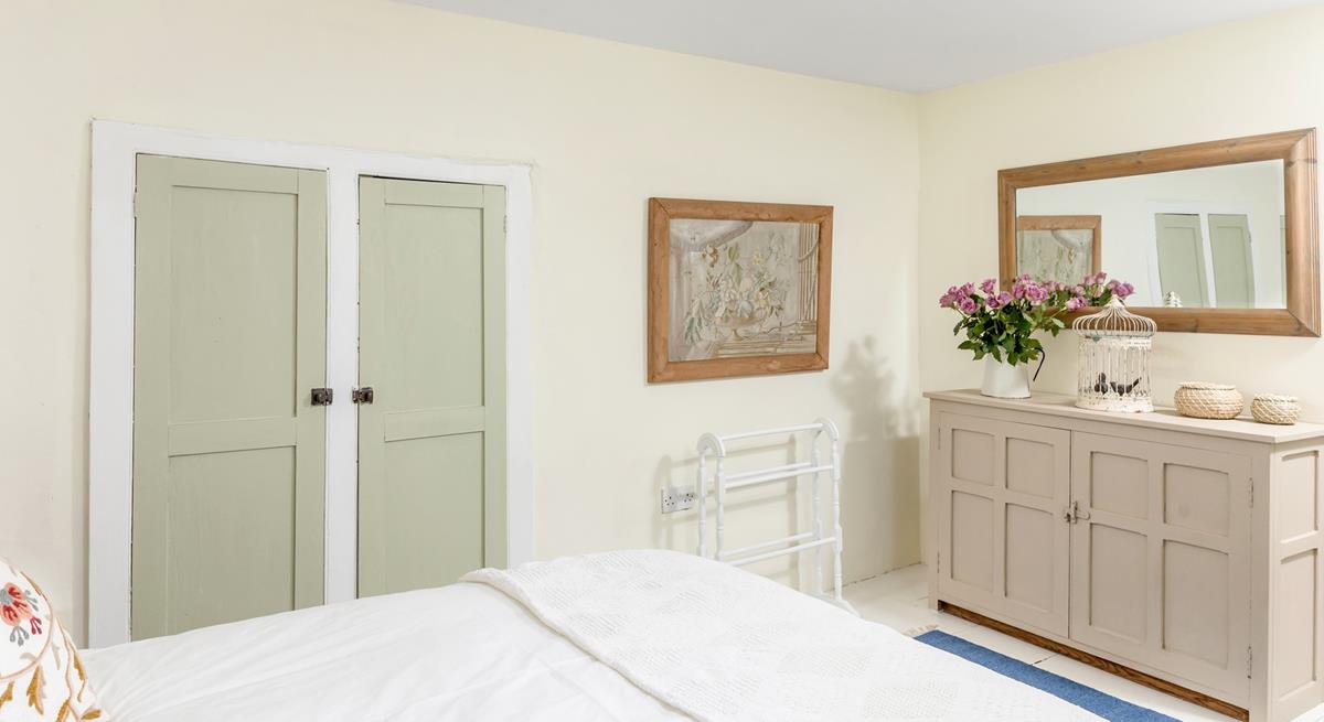 Neutral hues create a serene bedroom for a peaceful slumber.