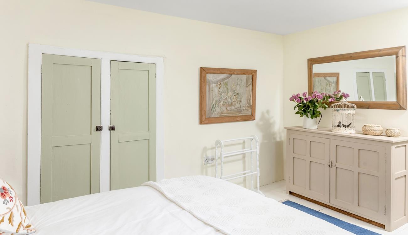 Neutral hues create a serene bedroom for a peaceful slumber.