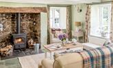 Snuggle up in front of the log burner after a day of exploring the outstanding beauty of the local area. - Thumbnail Image