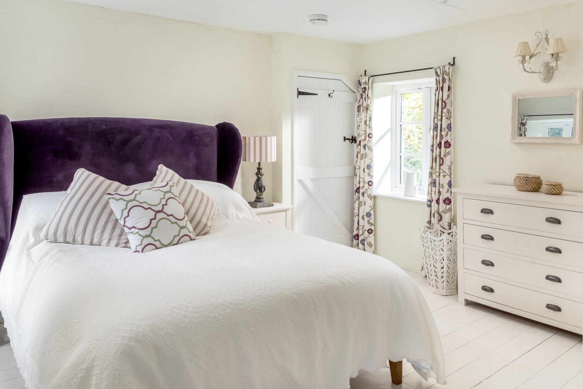 The main bedroom has a luxurious king size bed for slow mornings.