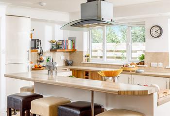 The open plan kitchen and dining layout means you can cook and dine together as a family.