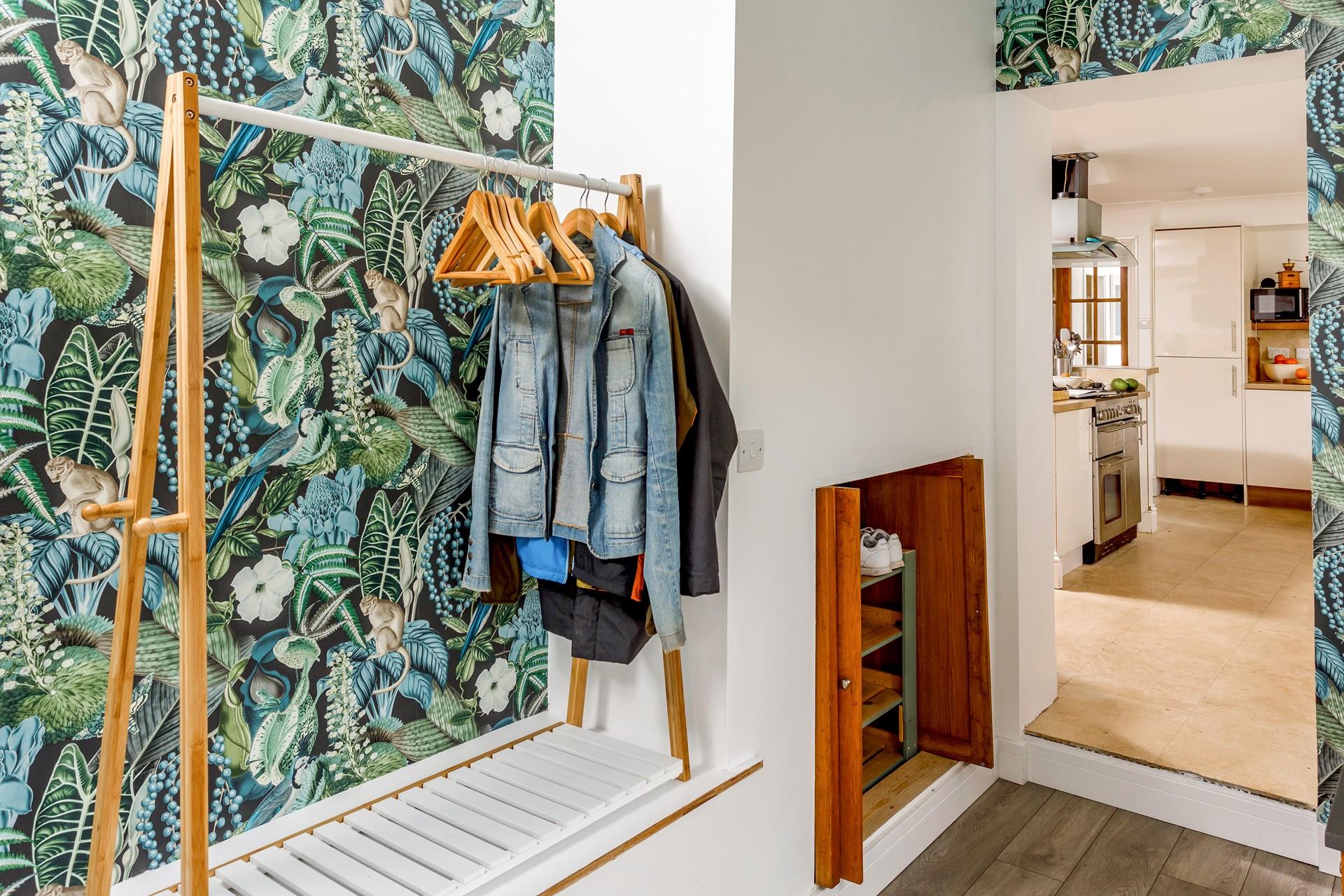 The porch has plenty of space to hang bags, coats and shoes.