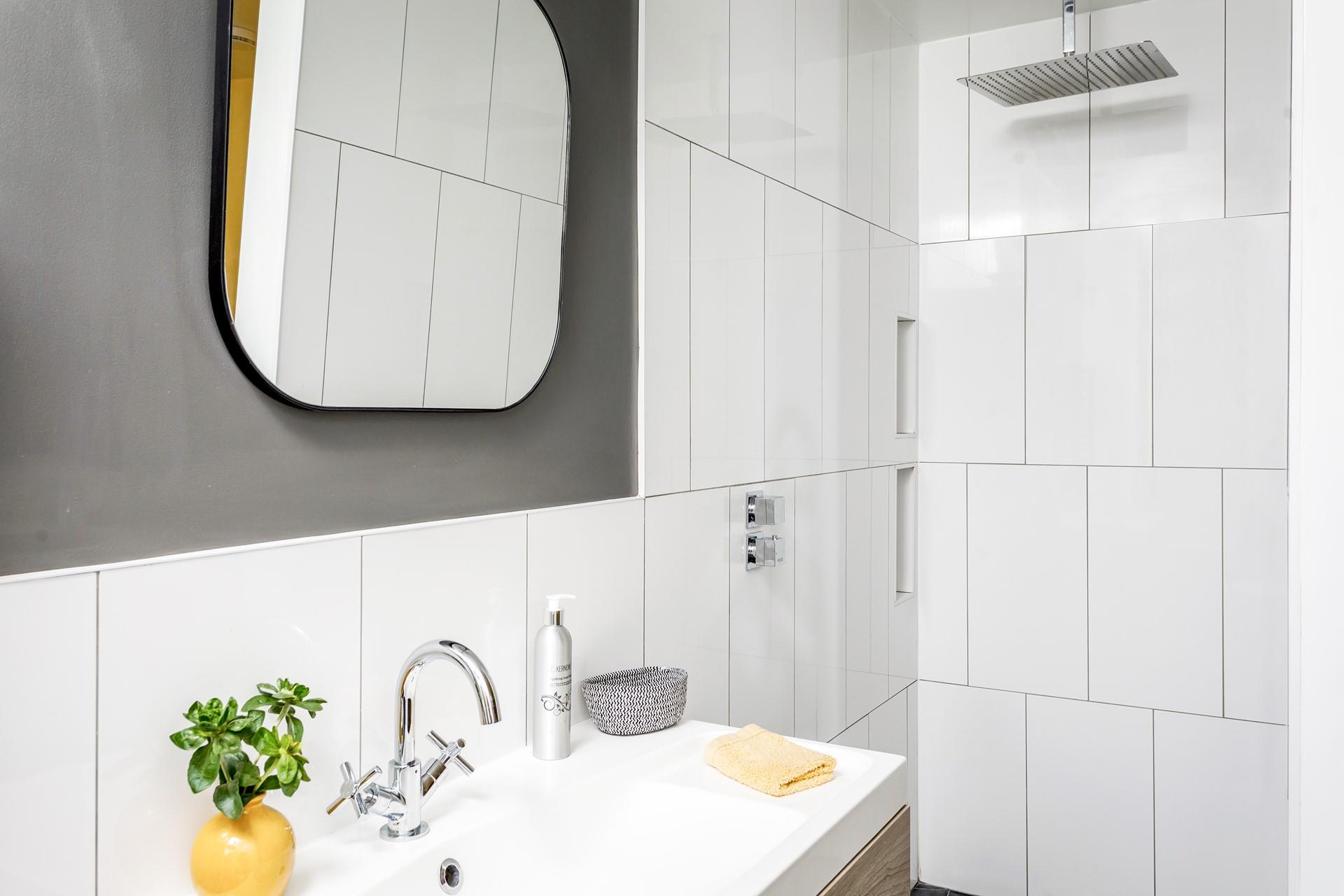 The en suite is modern and the perfect space to get ready.