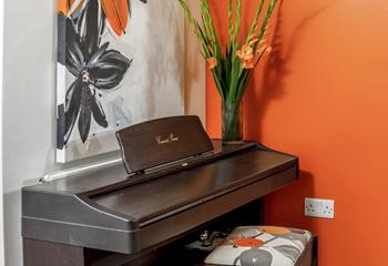 Music lovers will love the piano in the dining room!
