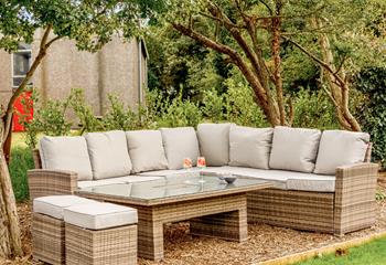 Relax and unwind on the rattan furniture with a cold drink.