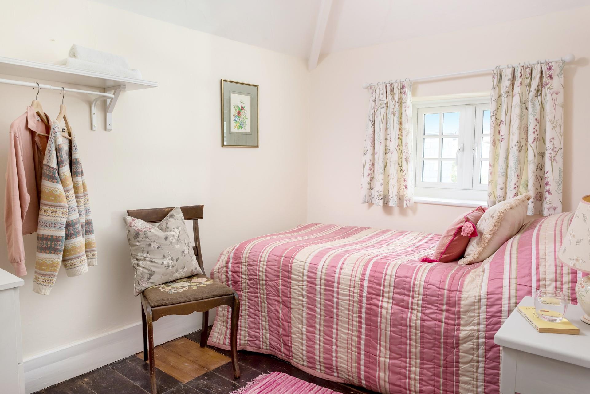 Bedroom 3 has a single bed perfect for young adults or children.