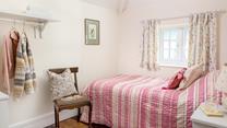 Bedroom 3 has a single bed perfect for young adults or children.