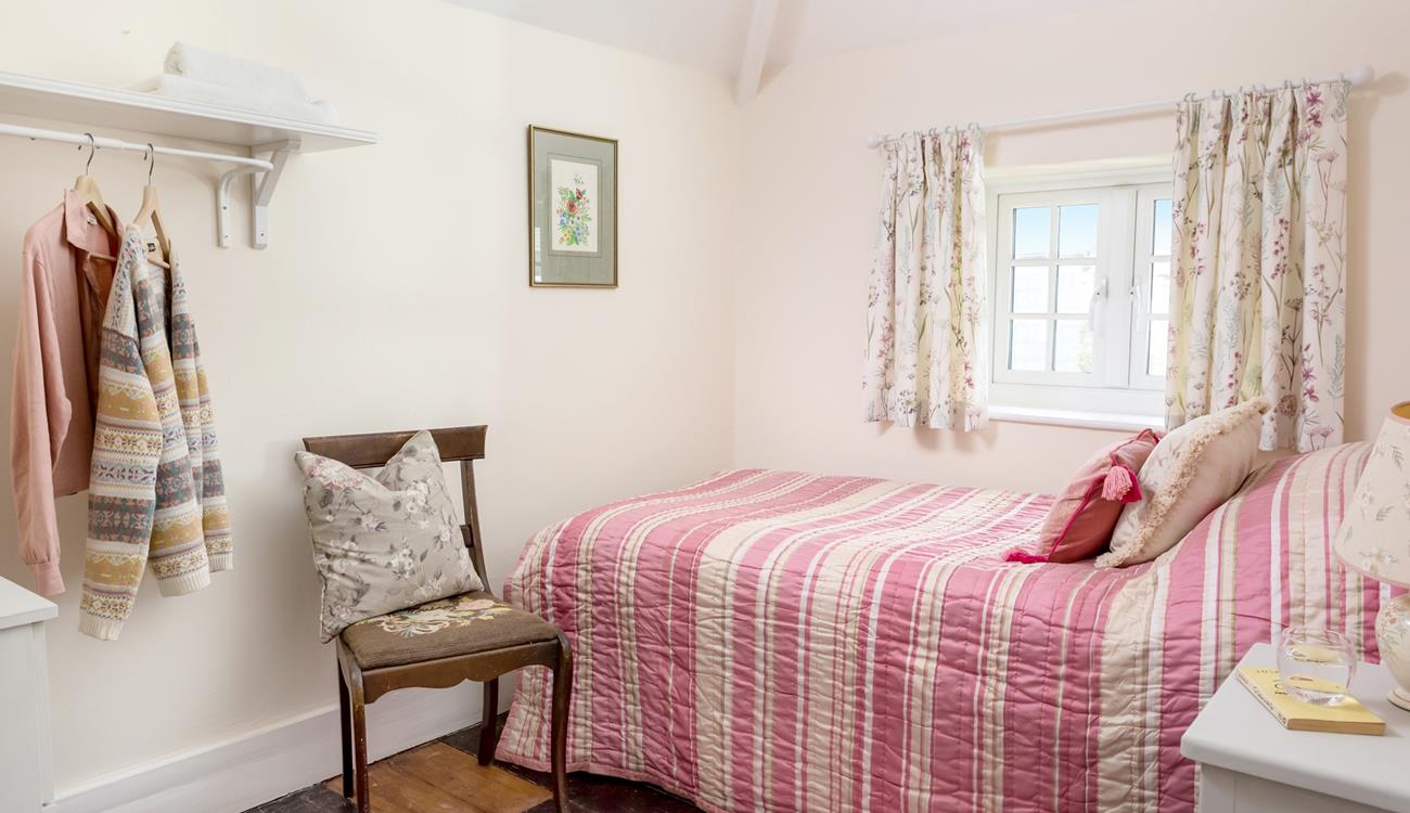 Bedroom 3 has a single bed perfect for young adults or children.