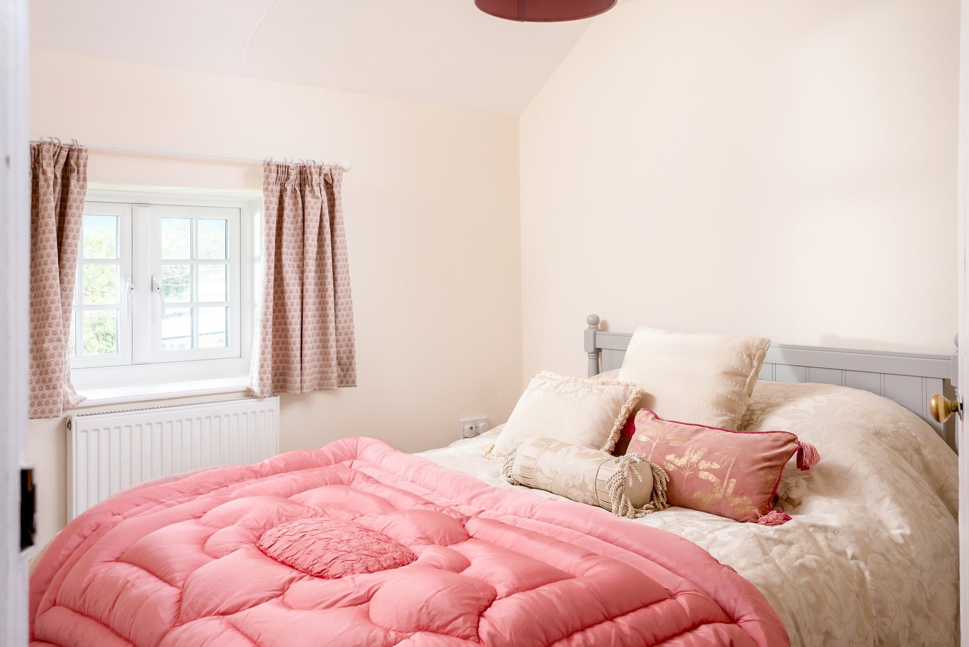 Bedroom 4 has a spacious king size bed and is perfectly cosy for a relaxing night's slumber.