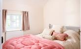 Bedroom 4 has a spacious king size bed and is perfectly cosy for a relaxing night's slumber. - Thumbnail Image