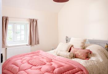 Bedroom 4 has a spacious king size bed and is perfectly cosy for a relaxing night's slumber.