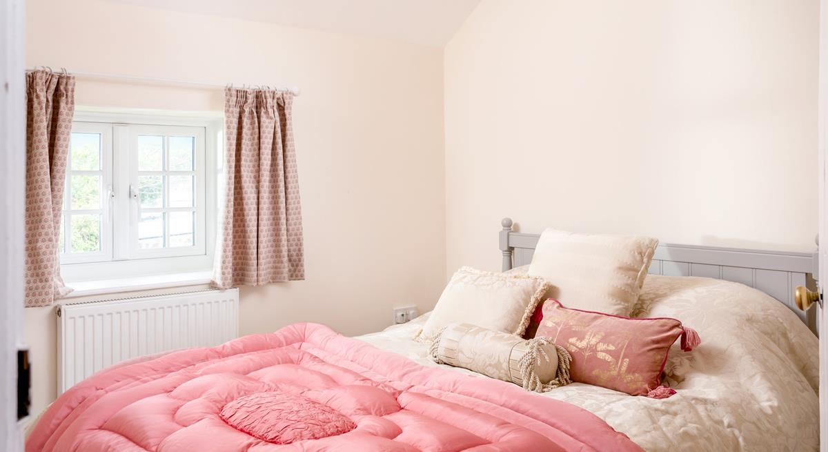 Bedroom 4 has a spacious king size bed and is perfectly cosy for a relaxing night's slumber.