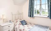 Bedroom 1 has a single bed and idyllic countryside views. - Thumbnail Image