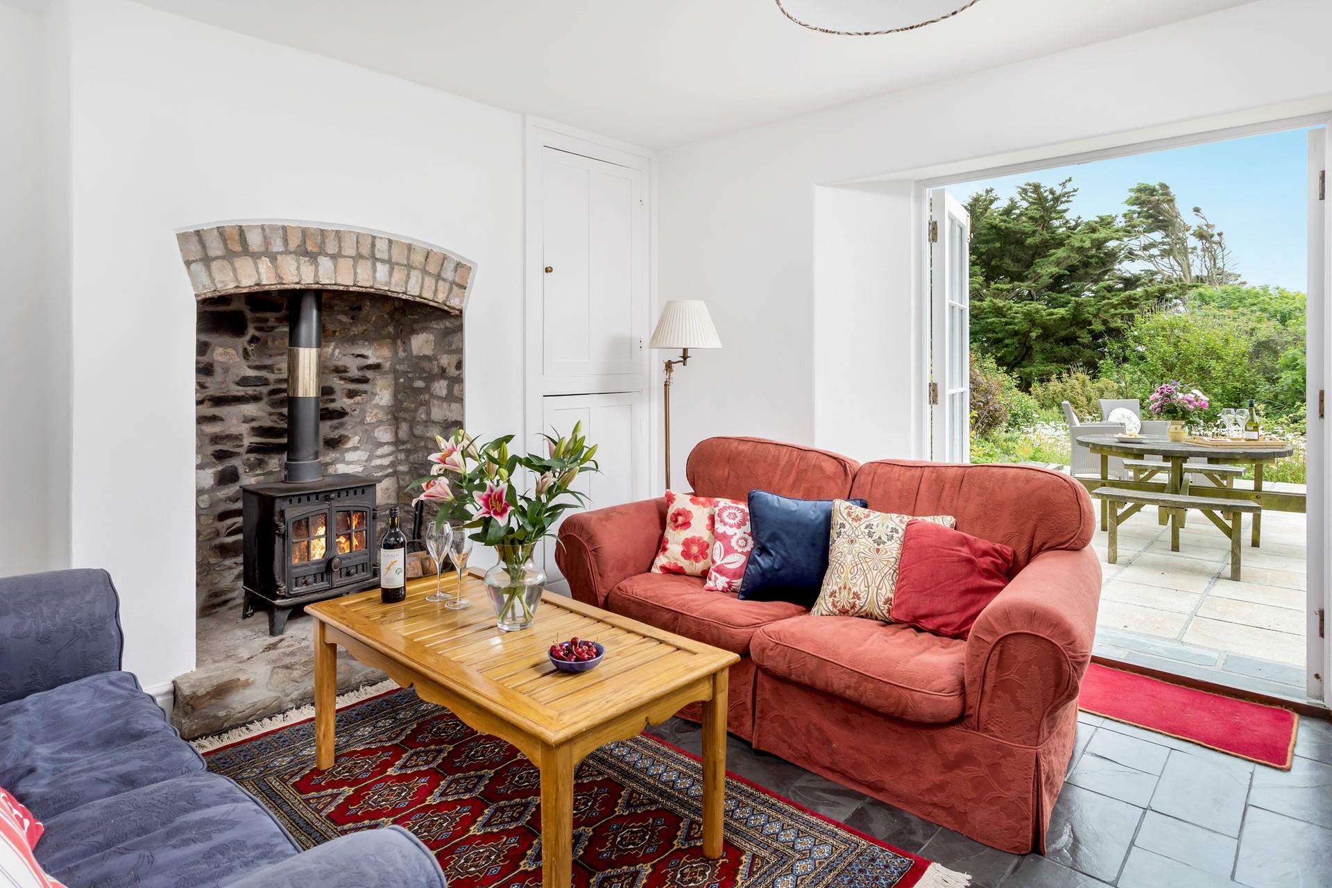 Snuggle up in front of the woodburner on chilly evenings on the sumptuous sofa.
