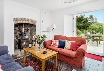 Snuggle up in front of the woodburner on chilly evenings on the sumptuous sofa.