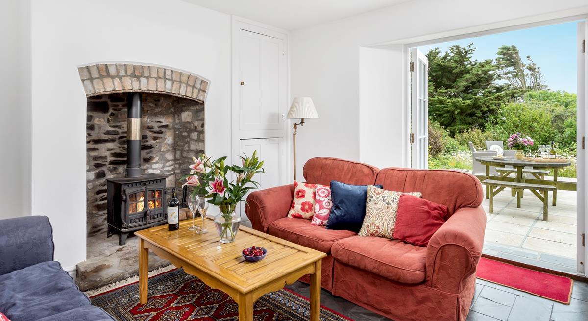 Snuggle up in front of the woodburner on chilly evenings on the sumptuous sofa.