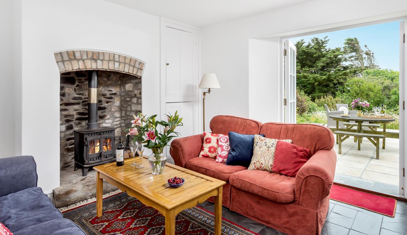 Snuggle up in front of the woodburner on chilly evenings on the sumptuous sofa.