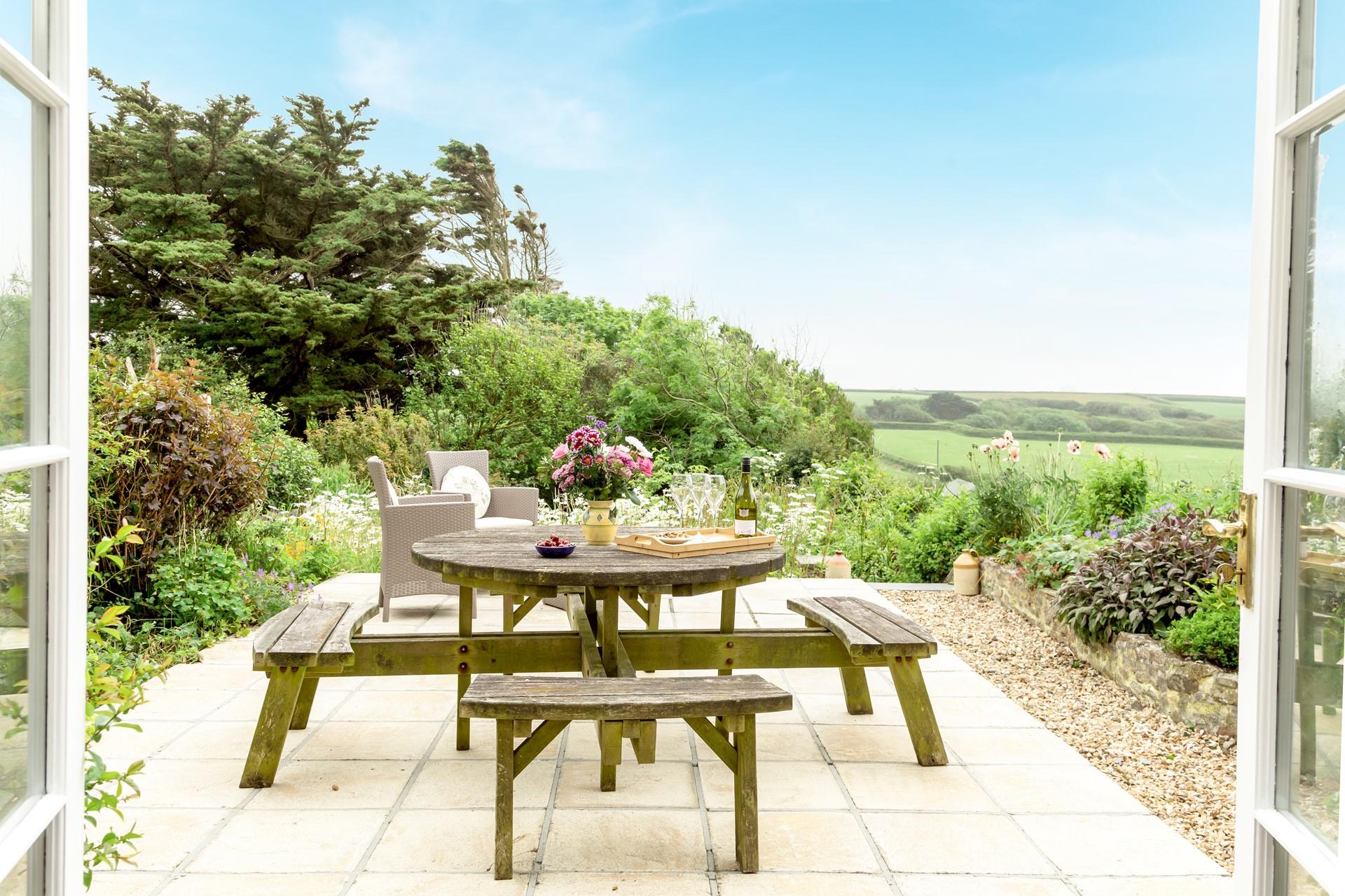Enjoy the fresh air and countryside views in the garden in the afternoon sun.