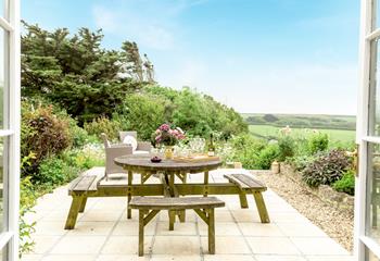 Enjoy the fresh air and countryside views in the garden in the afternoon sun.