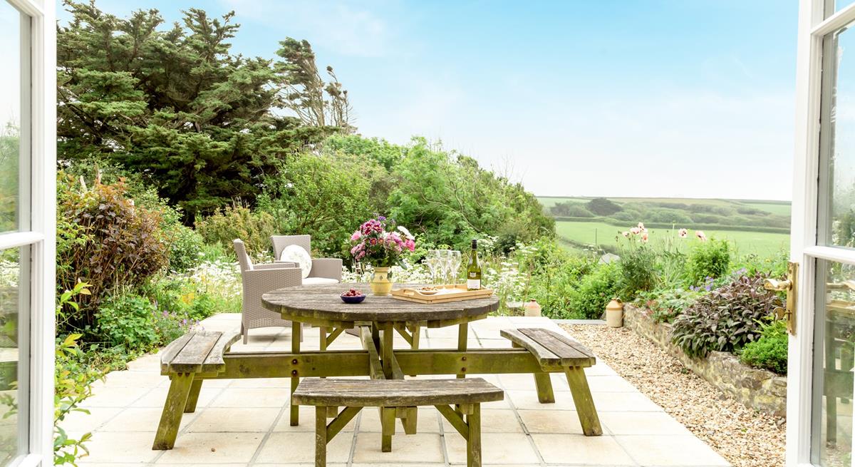 Enjoy the fresh air and countryside views in the garden in the afternoon sun.