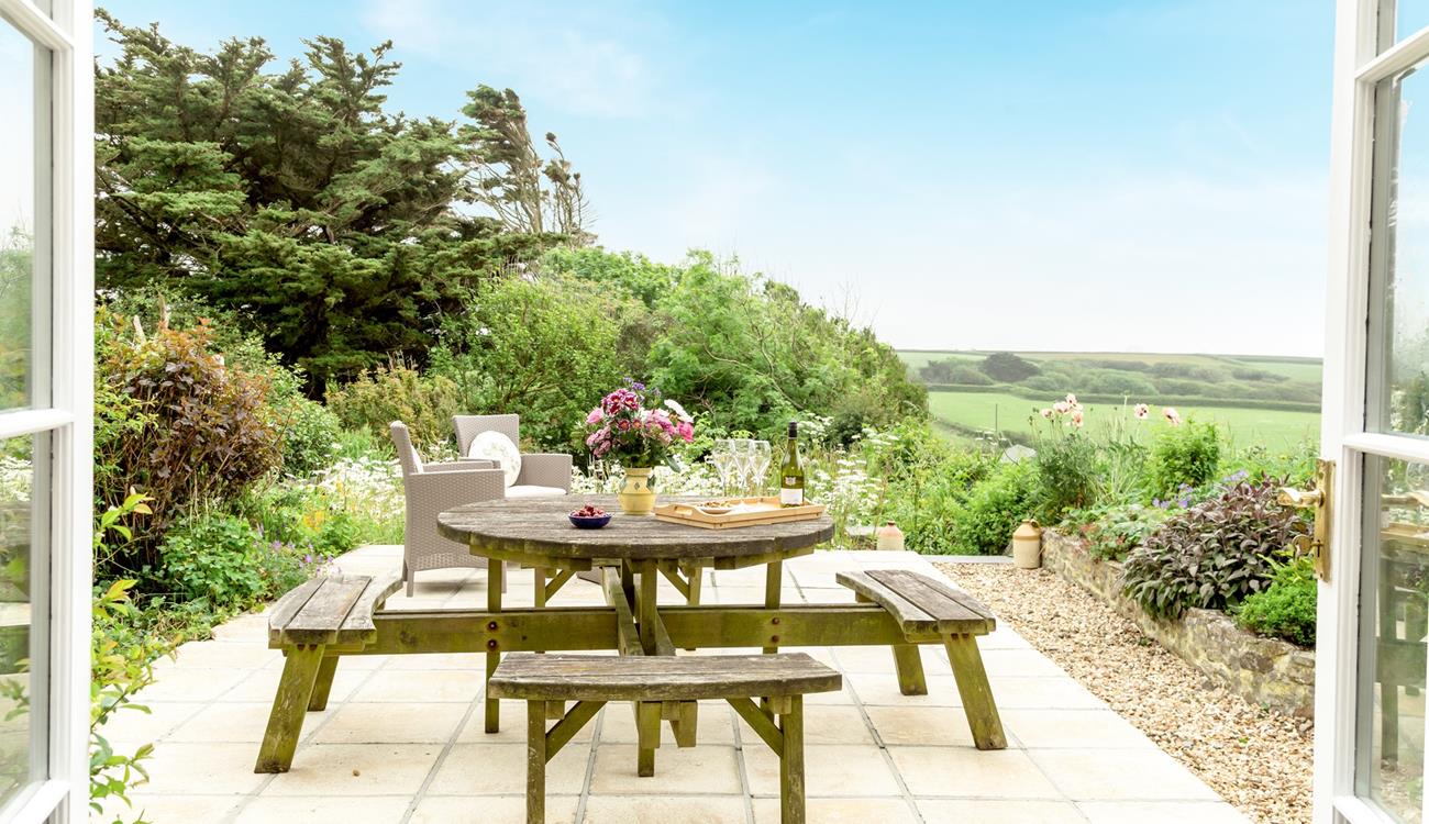 Enjoy the fresh air and countryside views in the garden in the afternoon sun.