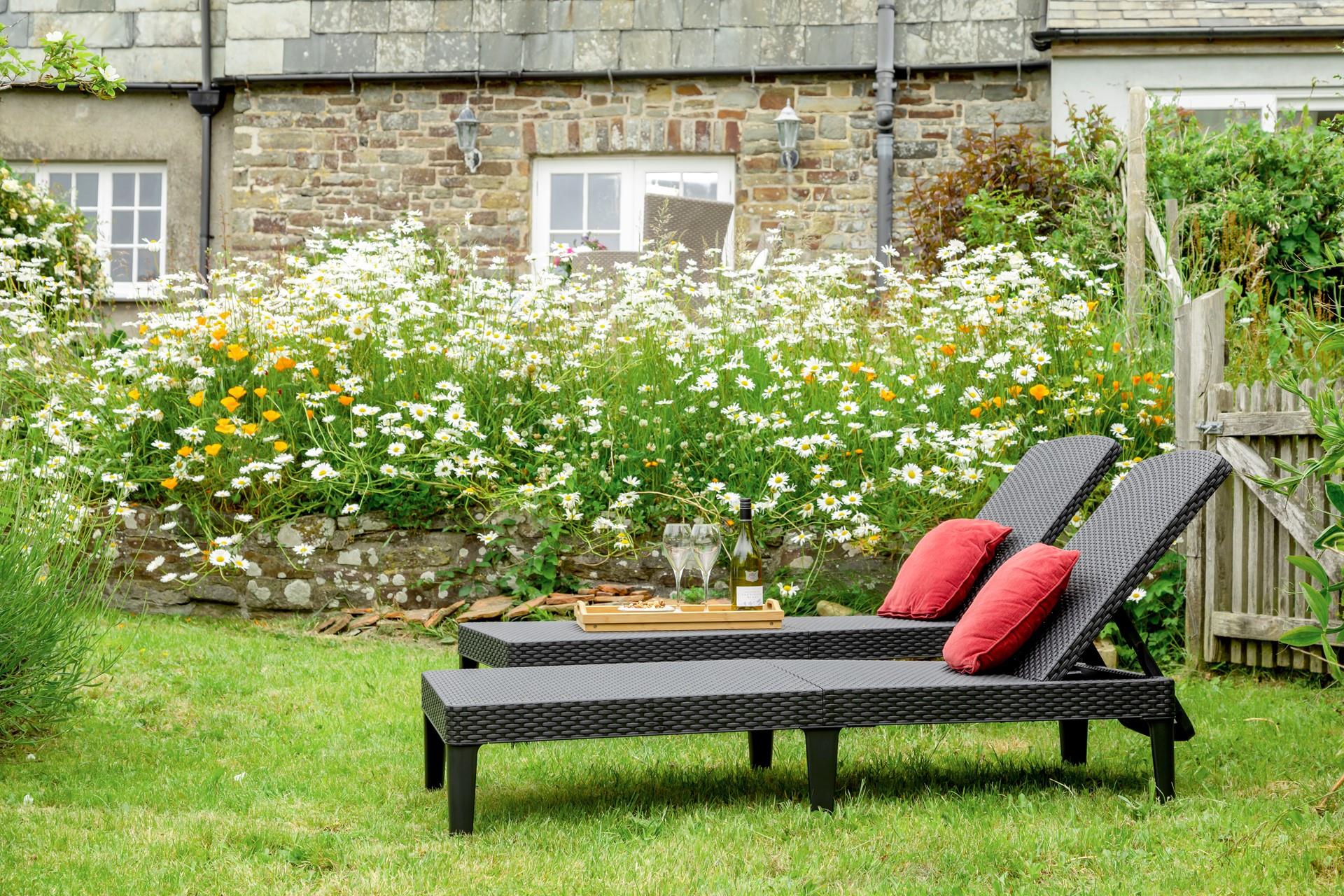 The rattan furniture is perfect for sunbathing on quiet days spent in the garden.