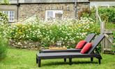 The rattan furniture is perfect for sunbathing on quiet days spent in the garden. - Thumbnail Image