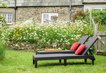 The rattan furniture is perfect for sunbathing on quiet days spent in the garden.