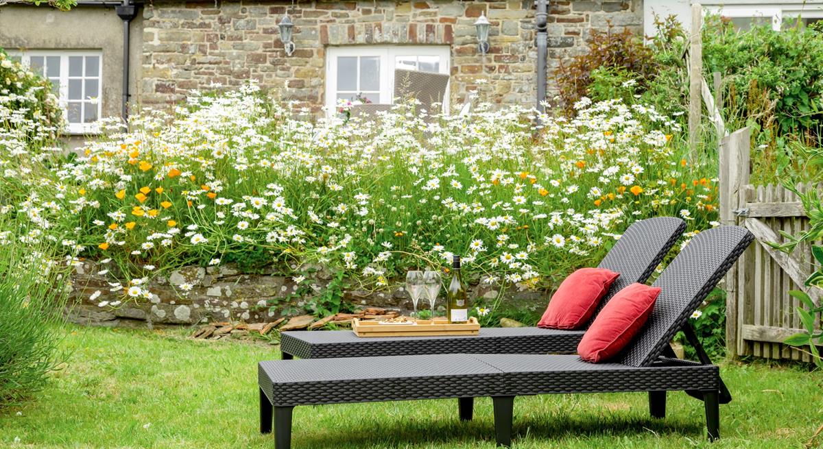 The rattan furniture is perfect for sunbathing on quiet days spent in the garden.