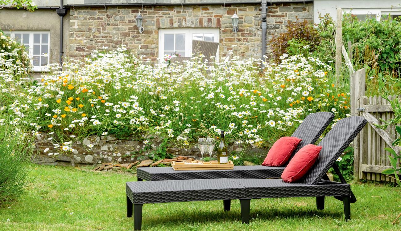 The rattan furniture is perfect for sunbathing on quiet days spent in the garden.