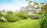 Relax on the sun loungers and enjoy the quiet and tranquil suntrap in the leafy garden. - Thumbnail Image