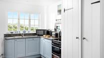 The kitchen is modern and fully equipped for rustling up delicious dinners and hearty cooked breakfasts.