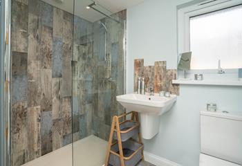 The contemporary en suite shower room is perfect for washing off sandy toes.