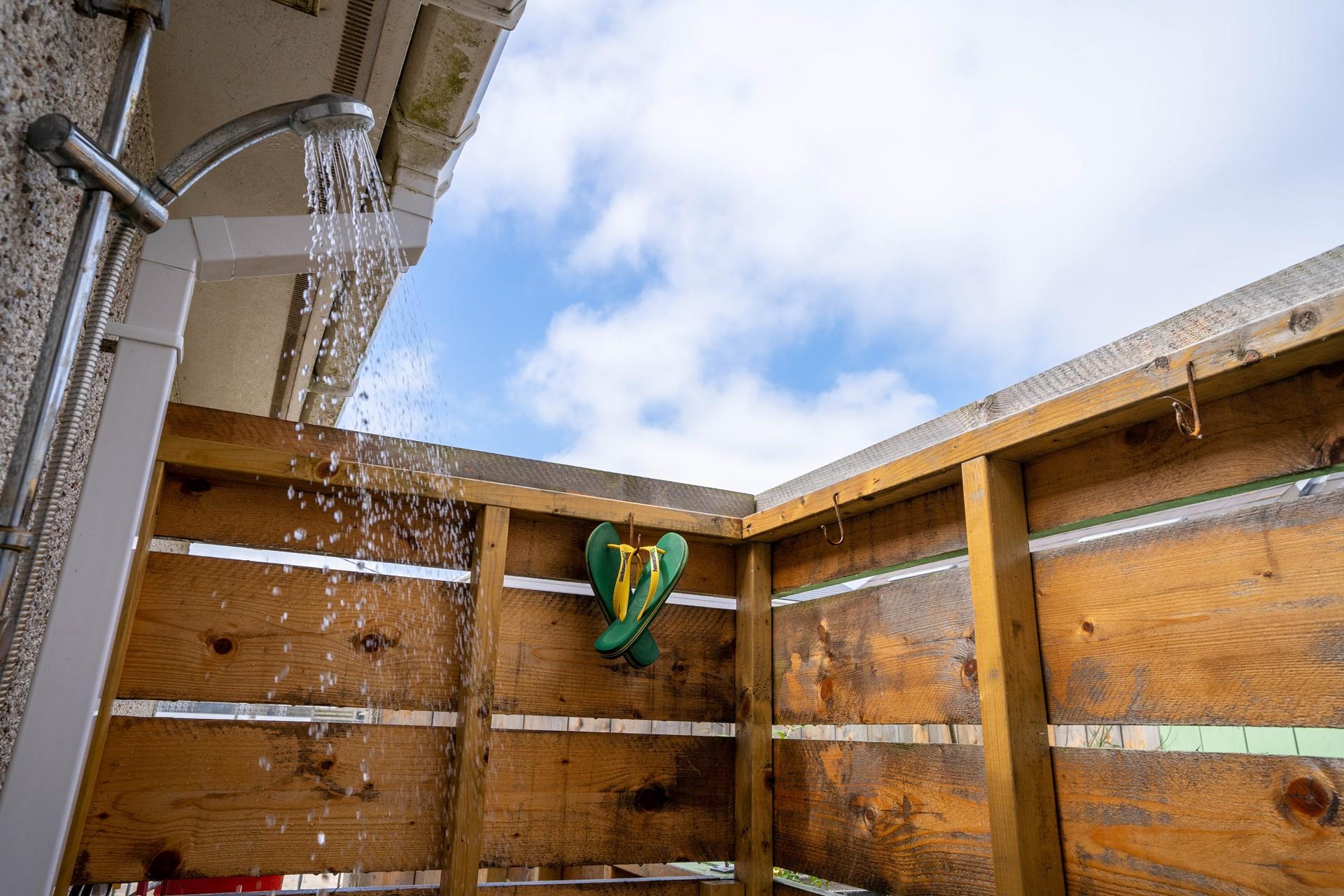 Warm outside shower perfect for washing off sandy toes.